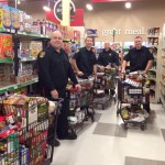 St. John’s Fire Fighters Adopt a Family at Christmas Program